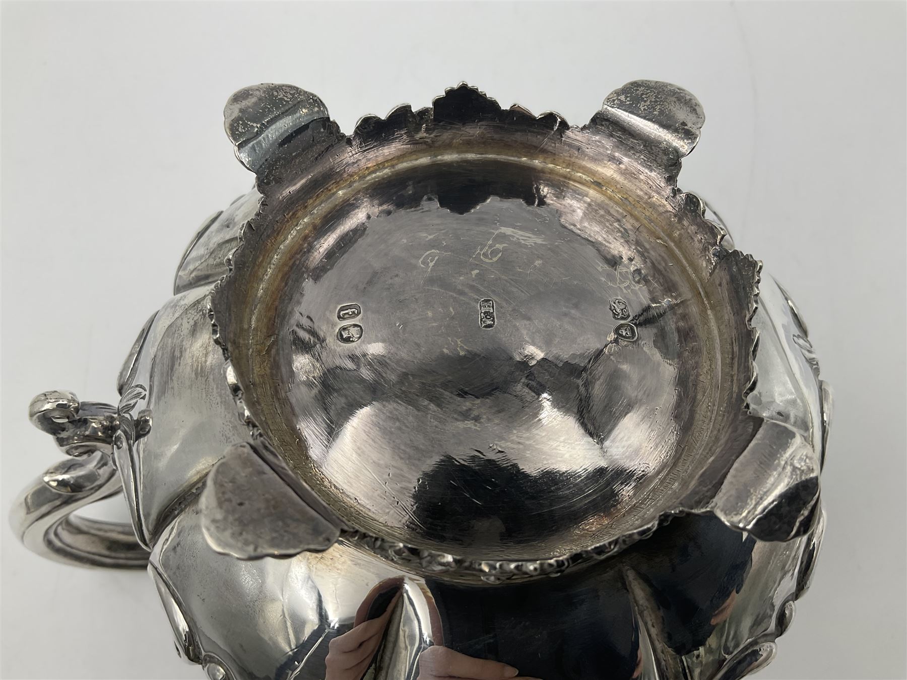 Victorian silver three piece tea service, comprising teapot, twin handled open sucrier, and milk jug, each of bellied form with acanthus capped scroll handles, the sides embossed with alternating scroll edged vacant panels and panels containing a pair of birds, upon four palmette feet, the teapot with ivory insulators to handle, and bird finial to the hinged domed cover, hallmarked William Hunter & Son, London 1861, teapot H19cm, including handles sucrier H13.5cm, including handle milk jug H12cm

This item has been registered for sale under Section 10 of the APHA Ivory Act