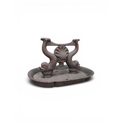 Victorian cast iron boot scraper, supported by two dolphins with central shell motif