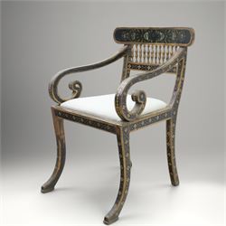 Early 20th century Anglo-Indian painted and inlaid armchairs, each with shaped top rail decorated with polychrome floral motifs above turned spindle galleries, shaped open arms and upholstered seats, on square supports with similar painted decoration
