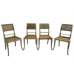 Collection of Regency dining chairs - set of four Regency painted beech dining chairs, with cane seat and back, on collar turned supports with splayed feet (W46cm, H84cm); a pair of Regency ebonised dining chairs (W47cm, H77cm); and a single Regency dining chair, the cresting rail painted with floral cornucopias and central putto vignette, X-frame back over cane seat, on collar turned front supports painted with foliage (W46cm, H84cm) (7)