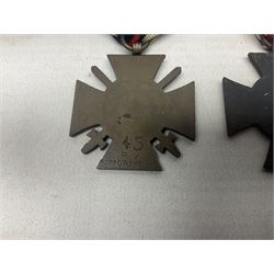 Two WW1 German medals - copy Cross of Honour with swords (combatants); Cross of Honour without swords (non-combatants); and two WW2 German medals - War Merit Medal; and War Merit Cross; all with ribbons (4)