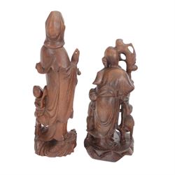 Chinese temple bell, brass bell decorated in relief with dragon on a carved hardwood stand, together with a cast resin figure of Buddha and two carved wooden figures, bell stand H47cm