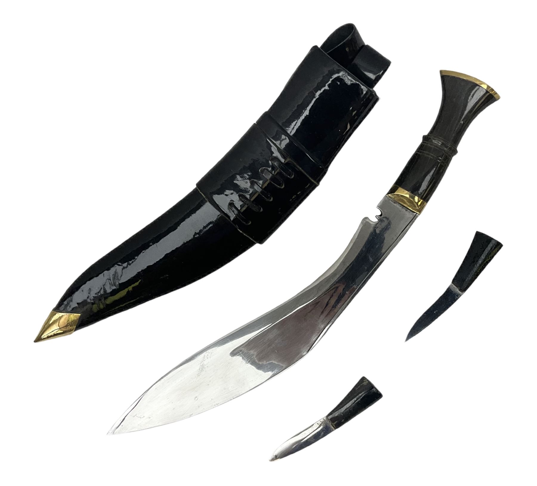 Ceremonial kukri, the 28.5cm curving blade inscribed 'O RDEP NEPAL 9/81' with brass mounted horn grip; in gloss black scabbard with two skinning knives 41cm overall