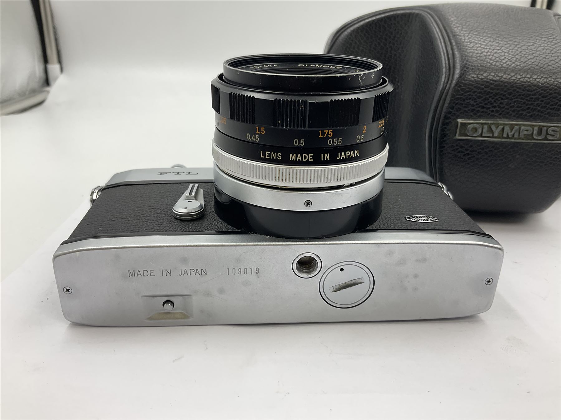 Olympus FTL camera body, serial no. 109019, with 'Olympus F.Zuiko Auto-S 1:1.8 f=50mm' lens serial no. 101434, in leather case 