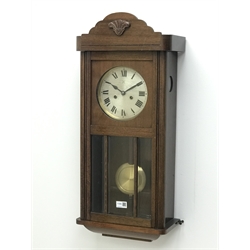  20th century oak cased wall clock, glazed door and silvered dial striking the half hors on a gong, H81cm  