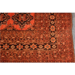  Large Persian red ground carpet, repeating border, 285cm x 364cm  