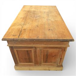Late 19th century Victorian pine twin pedestal desk, rectangular plank top above an arrangement of seven drawers with brass swan neck handles, each pedestal fitted with one drawer above a double height drawer, raised on plinth bases with panelled sides