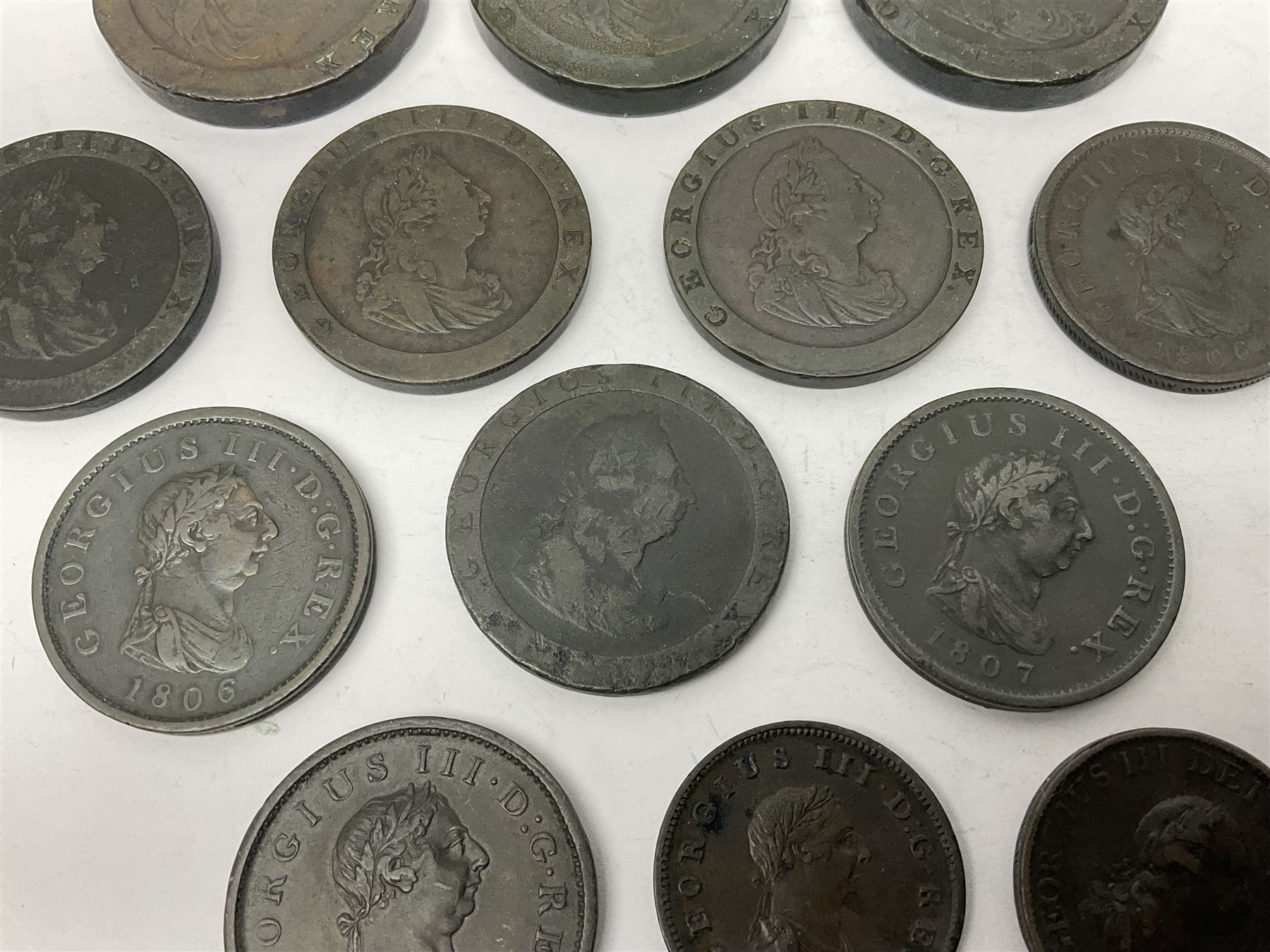Two George III halfpenny coins dated 1799 and 1806, four pennies dated three 1806 and 1807, four 1797 cartwheel pennies and three 1797 cartwheel two pence coins