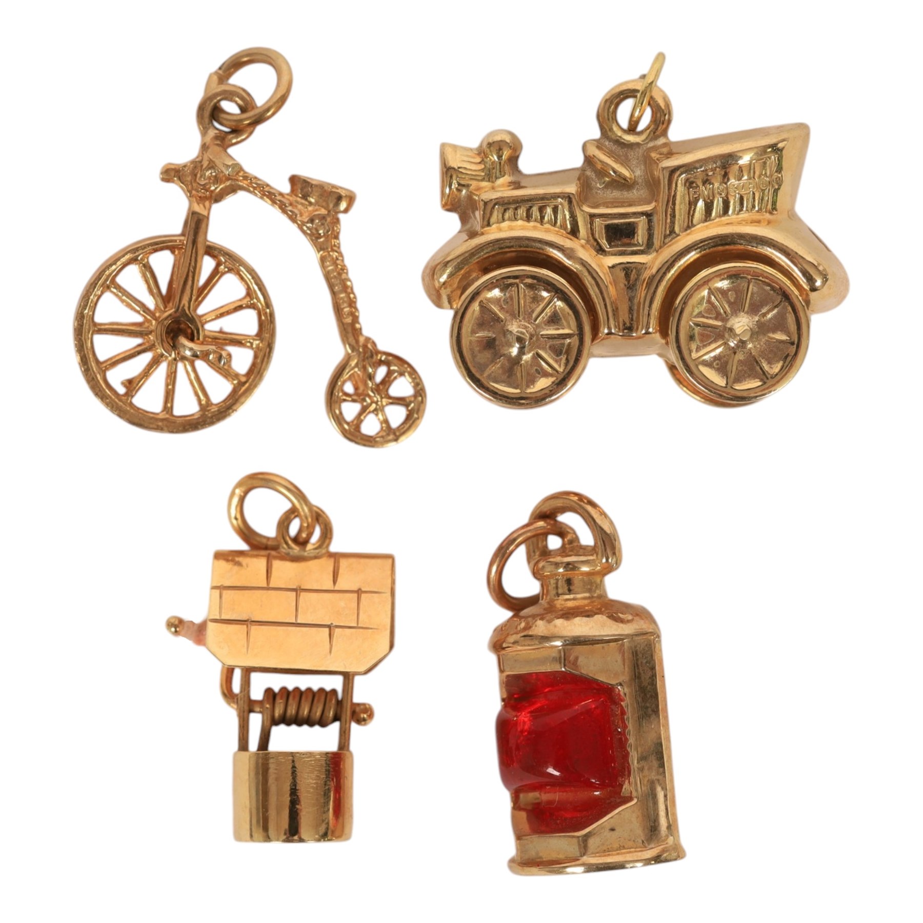 Four 9ct gold charms including penny-farthing, car, lamp and well, all hallmarked