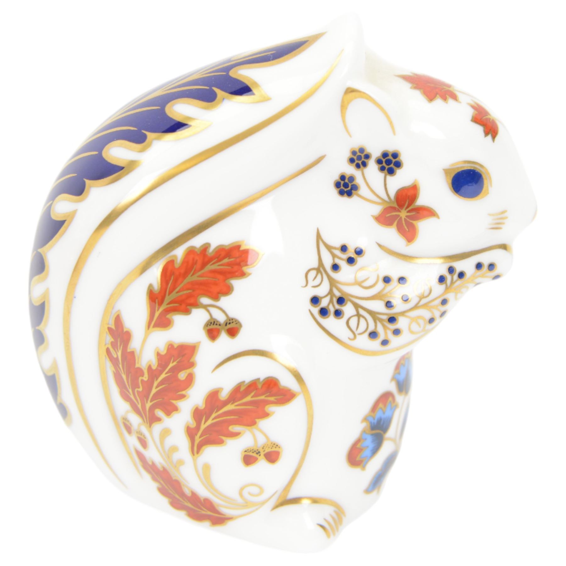 Four Royal Crown Derby paperweights, comprising Puffin, Squirrel, Badger, and Tiger Cub, each with silver stoppers