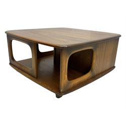 Lucian Ercolani for Ercol - elm 'Pandora's Box' coffee table, square top with rounded corners over two drawers with sculpted recessed pulls, open sides supporting undertier, on castors 