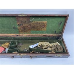 Leather, oak and brass shotgun case with Westley Richards & Co labels to the lid, fitted interior to accommodate 76.5cm barrels, containing assorted gun cleaning equipment, L83.5cm overall 