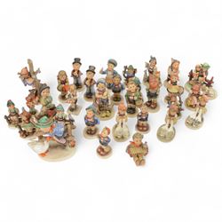 Collection of approximately  thirty four Hummel figures including Barnyard Hero, Strolling Along, Eventide Abendlied, Wayside Harmony etc 