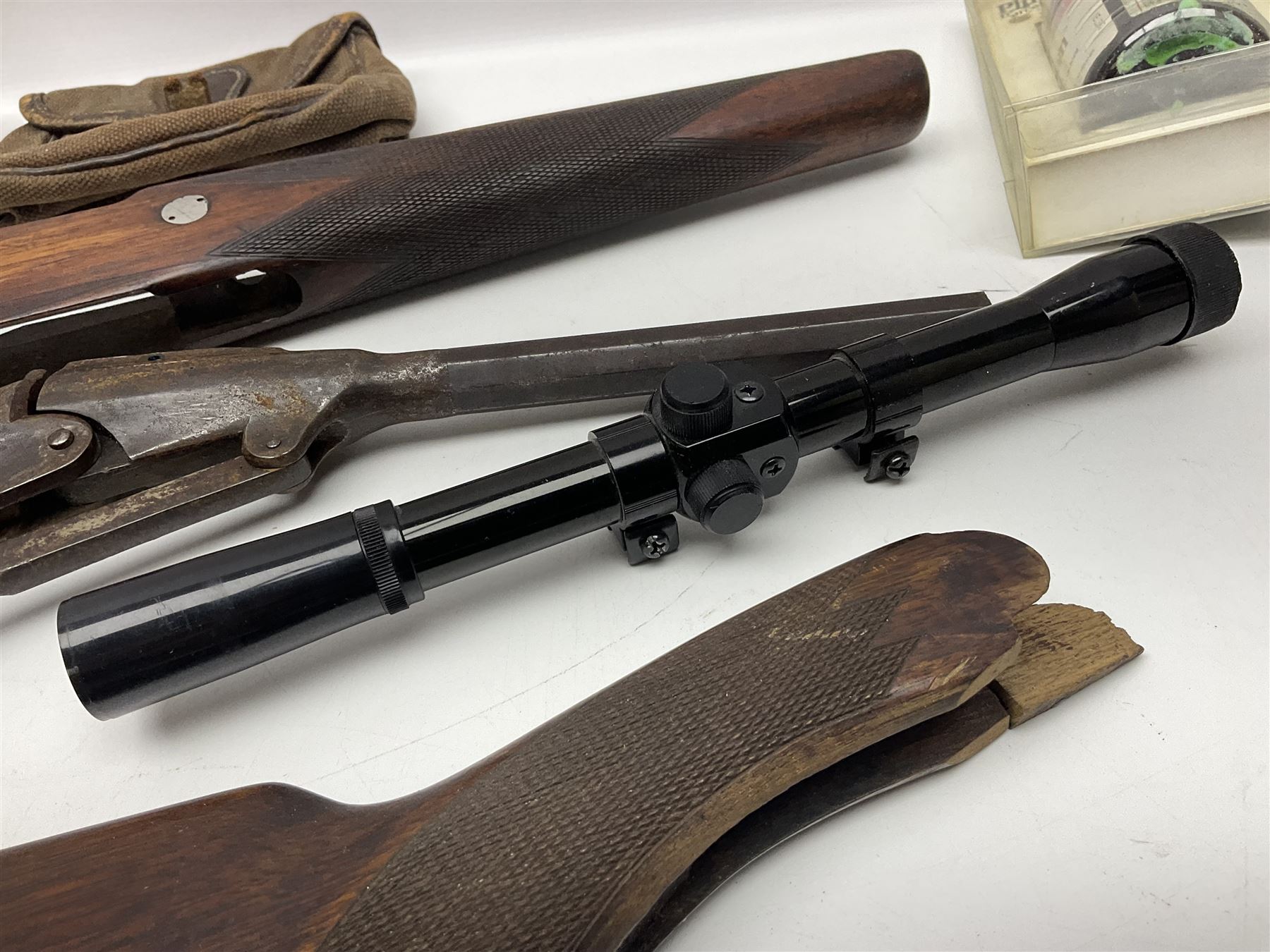 Assorted rifle and pistol spares; early Gem air rifle with sawn off barrel (piece present); telescopic sight; canvas/leather ammunition pouch; Mauser stock; barrel browning solution etc