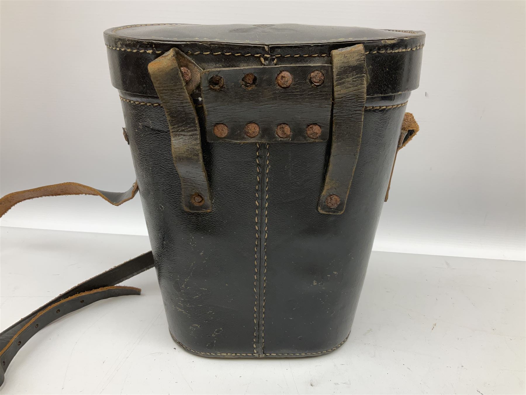 Pair of WWII German U-boat binoculars probably 7 x 50 by Leitz, with rubber eye piece protector covers and leather case stamped with Kriegsmarine mark to the lid and dated 1944, with leather strap.