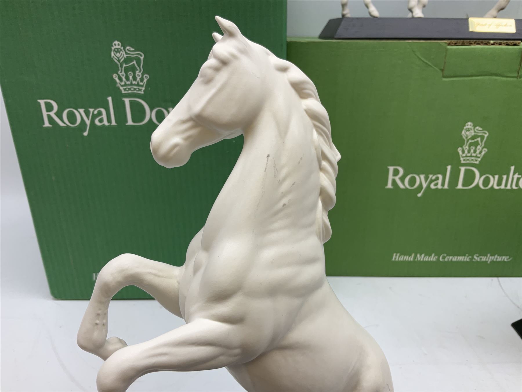 Five Beswick and Royal Doulton horse figures in matt white on black plinths, comprising of  Spirit of Affection no. 2689/2536, Springtime no.2837, Spirit of peace no.2916, Spirit of earth no.2914 and Spirit of the wild no. 183, together with a composite figure of a horse (6)