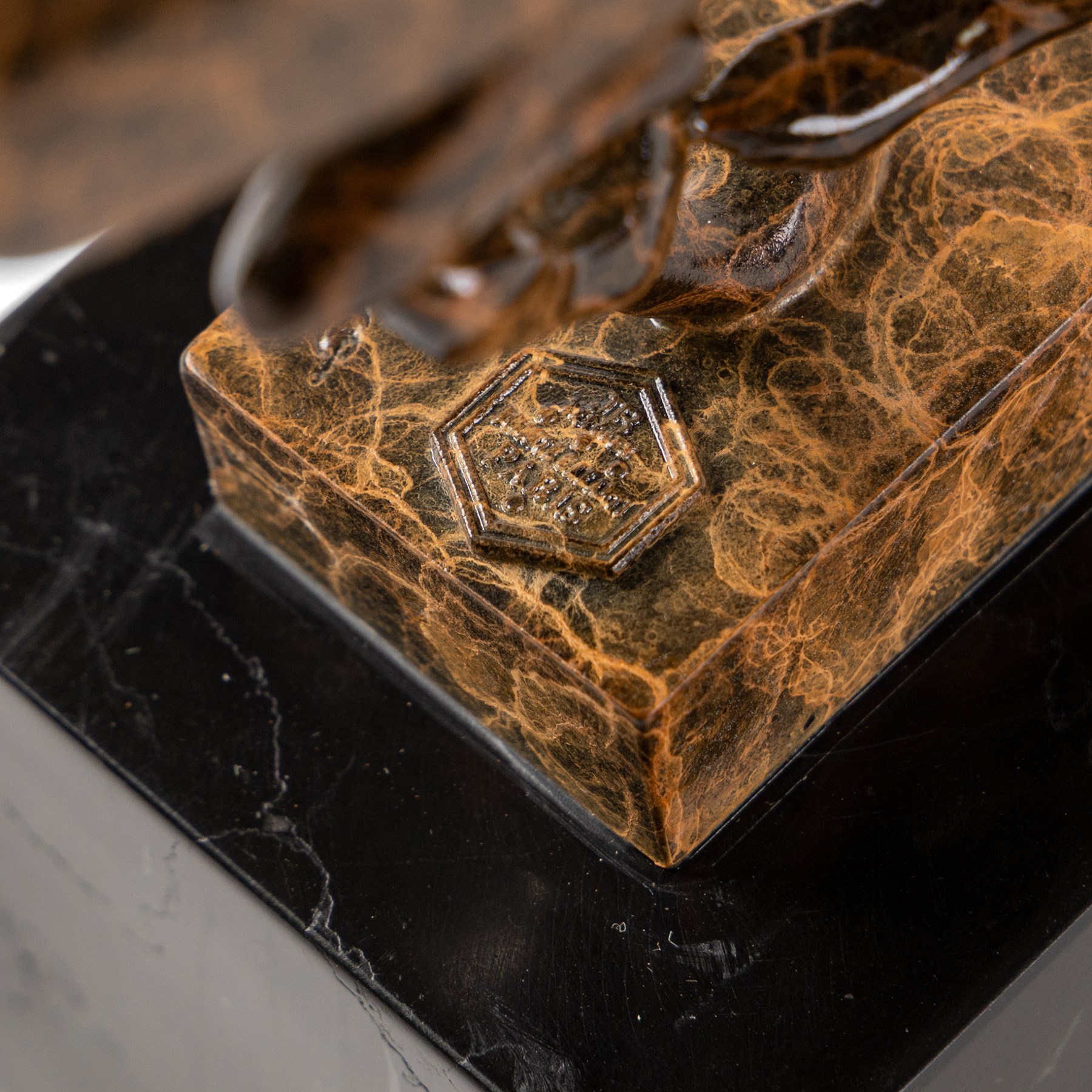 After Milo - Bronze two toned running cheetah, upon a rectangular marble base, with foundry mark, H20cm