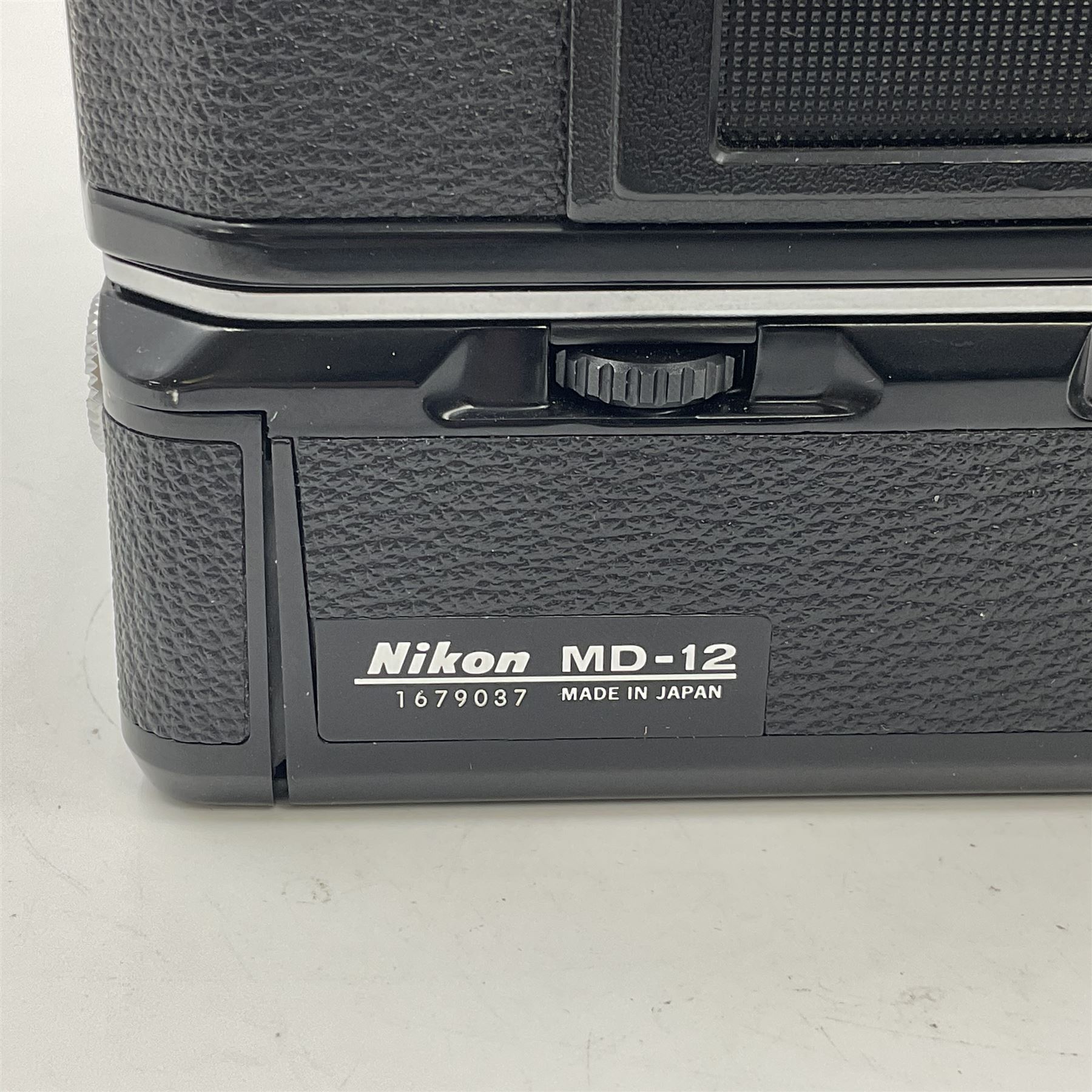 Nikon FE2 camera body, serial no. 2043167, with 'Nikon Zoom-NIKKOR 35-70mm 1:3.3-4.5' lens, serial no 3006624 and Nikon MD-12 Motor Drive, serial no. 1679037