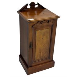 Victorian walnut bedroom suite - wardrobe, dressing chest and bedside cupboard, comprising a full-length wardrobe with broken pediment and central mirrored door, large lower drawer, a matching dressing table with bevelled swing mirror over two trinket drawers and two short drawers over two long drawers, and a single-door bedside cupboard, all with moulded edges, decorative panel work and shaped aprons