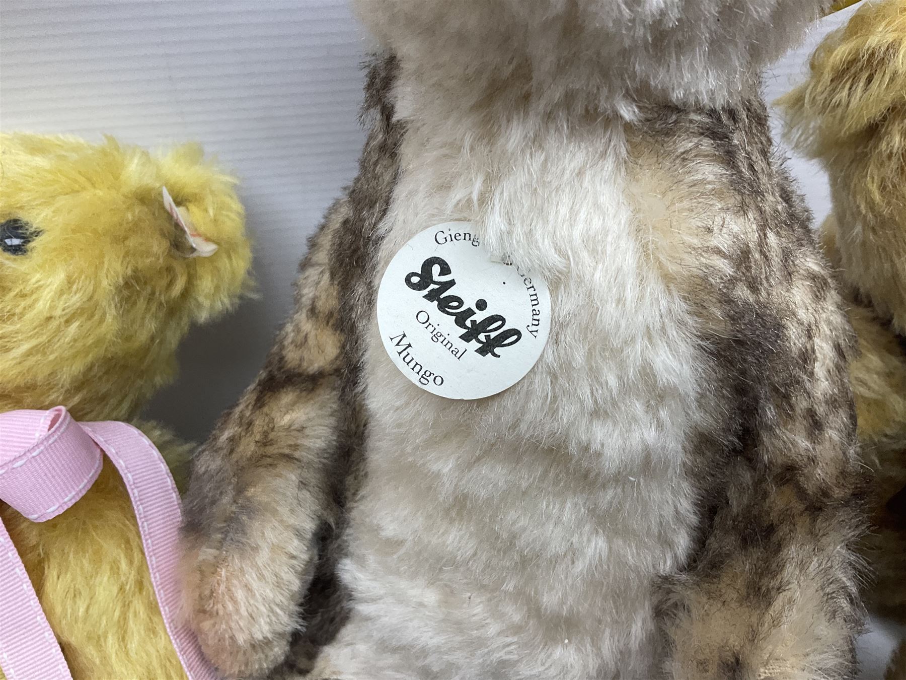 Seven modern Steiff teddy bears comprising two limited edition '1908 Paul the Growler' bears Nos.1124/3000 and 1310/3000; 028649 Classic Teddybear 23; 005992 Classic Teddybear 28 (black); 071249 Mungo Meerkat 30; 079139 Reclining dog for American Kennel Club; and 029561 Petsy gespitzt (1928) 16cm; together with a Mrs. McCatty's limited edition 2156 Sophie bear No.1557/1750; all unboxed but most with labels (8)