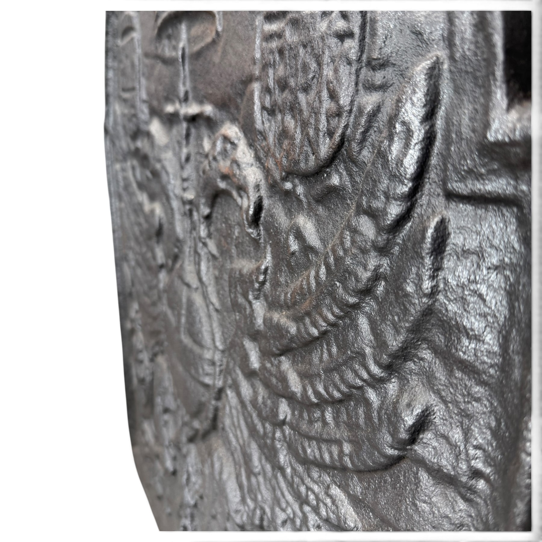 Early 20th century cast iron fireback, after an 18th century Flemish original, the arched plate cast in relief with the crowned Habsburg double-headed Imperial eagle and armorial shields of Charles V, Holy Roman Emperor