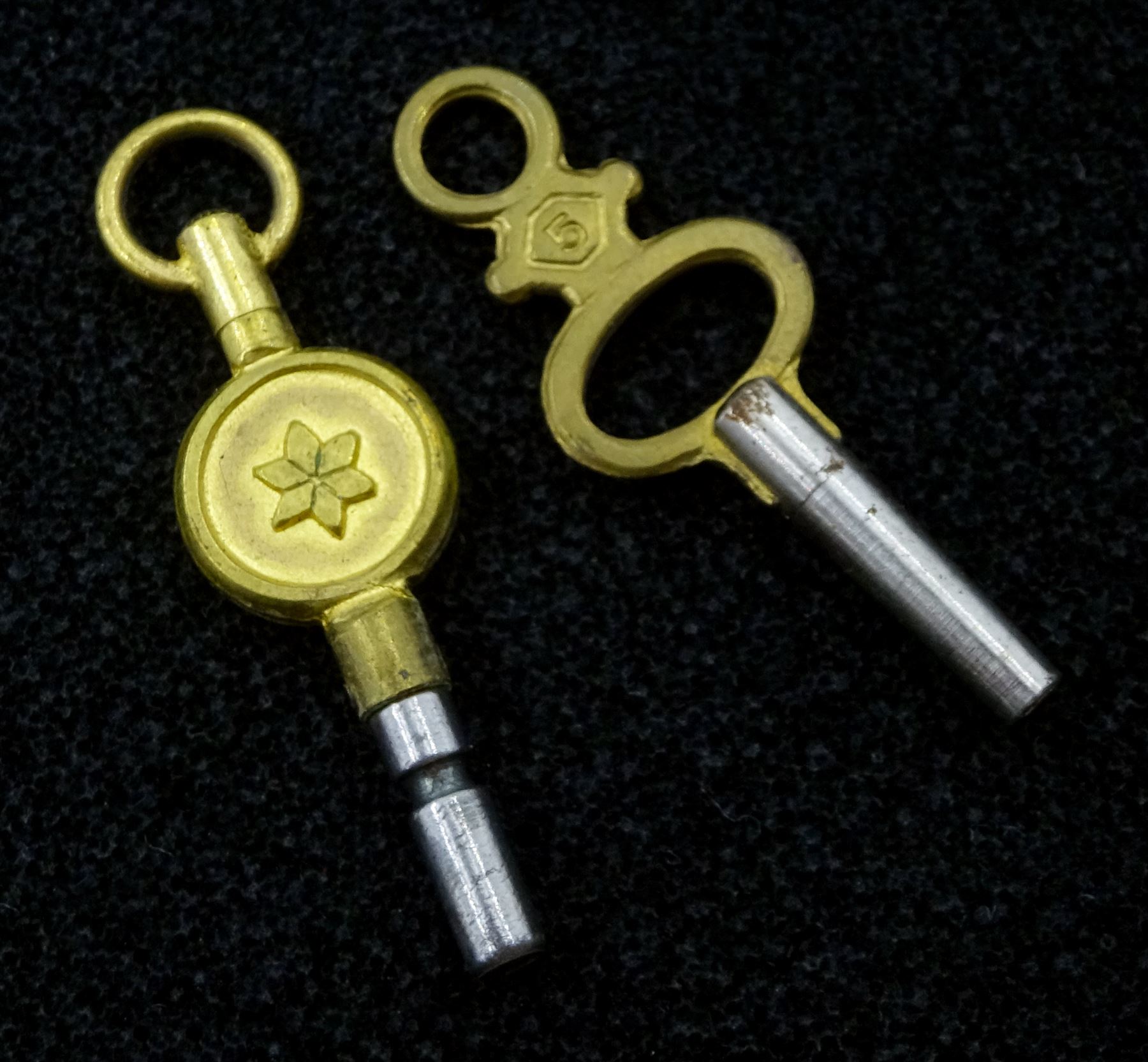 Victorian 18ct gold open face English lever fusee pocket watch by Frisch & Schierwater, Liverpool, No. 14789, cream dial with Roman numerals and outer Arabic minute ring, the back case with engraved decoration depicting a village scene, case by Christopher Jones, Chester 1843, on gold chain with silver vesta case by A & J Zimmerman Ltd