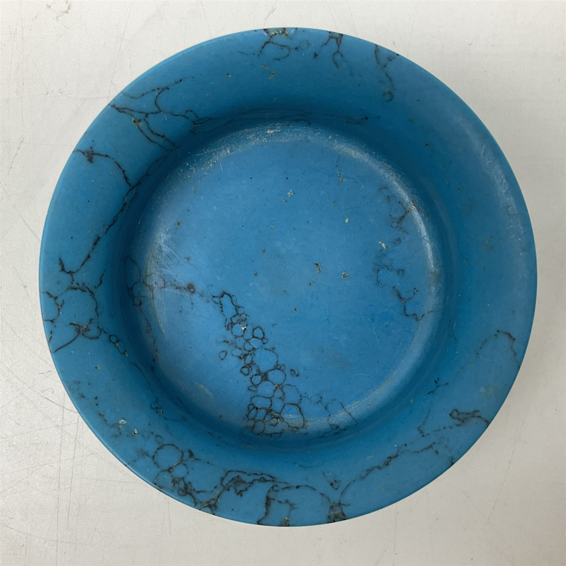 Carved single piece turquoise bowl with fluted rim, upon a raised footed base, D10cm, H5cm