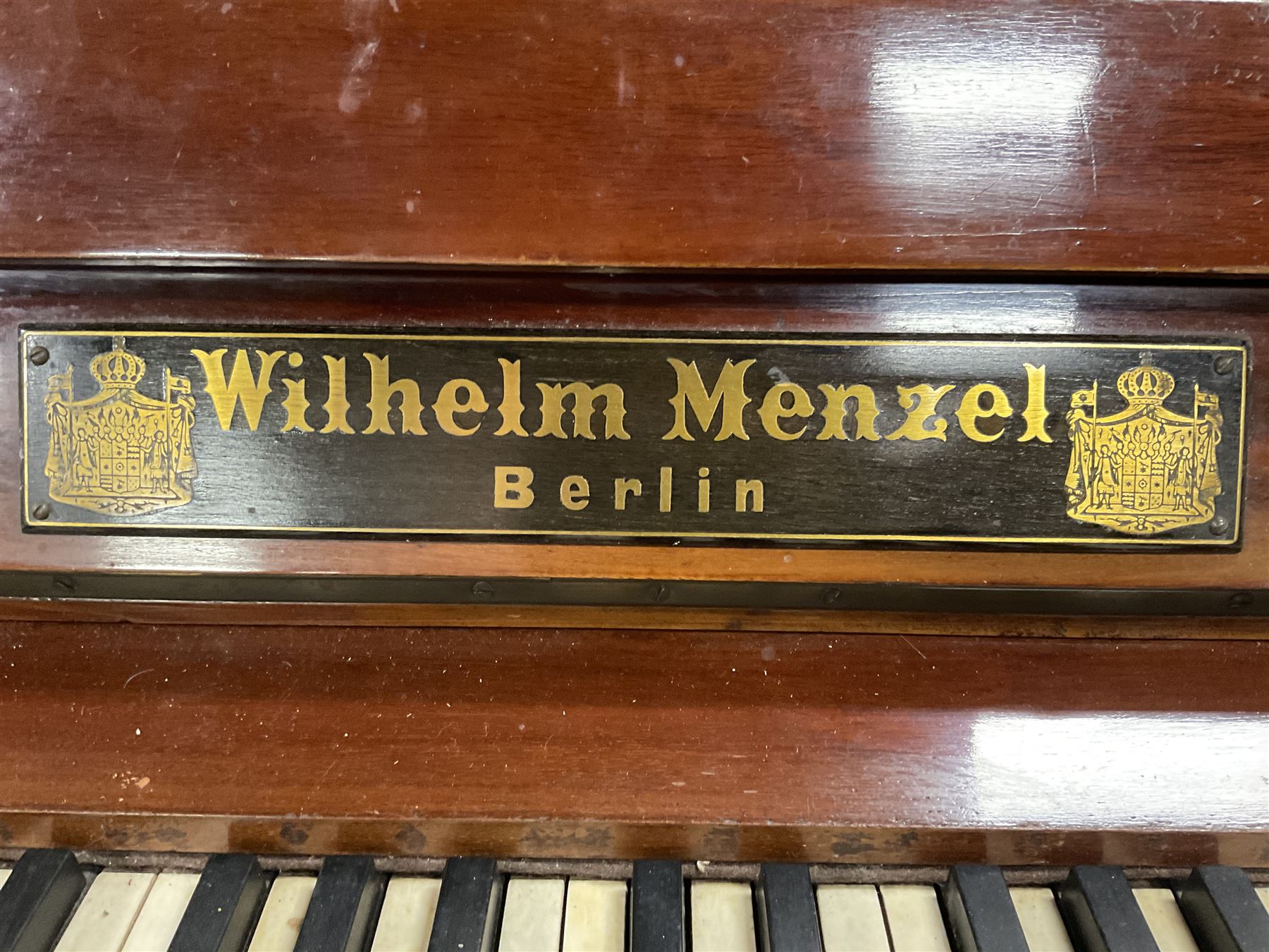 Early 20th century mahogany cast iron overstrung upright piano by Wilhelm Menzel Berlin