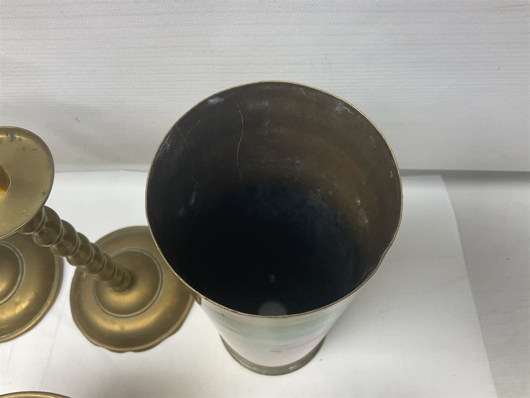 Collection of brassware, to include two jardinieres, candle sticks, brass shell, etc