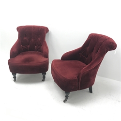 Pair Victorian style bedroom armchairs, upholstered in deep buttoned red fabric, turned supports, W70cm