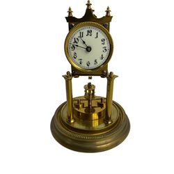 Gustav Becker - German Urania torsion clock with a glass dome, late 19th century 400-day movement with an enamel dial, arabic numerals and steel spade hands, movement supported by two brass pillars on a circular base, adjustable rotating pendulum with torsion suspension intact. With Key.