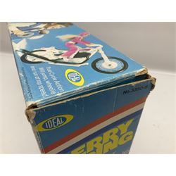 Ideal Derry Daring and Her Trick Cycle, with clothed figure on trick cycle and winder; in original illustrated box dated 1975