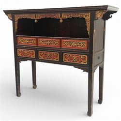 Chinese black lacquer Buddha cabinet, moulded top over open display recess framed by pierced geometric fretwork and corner spandrels, the base fitted with an arrangement of five drawers with carved and gilt scrollwork panels, on square supports with shaped apron brackets