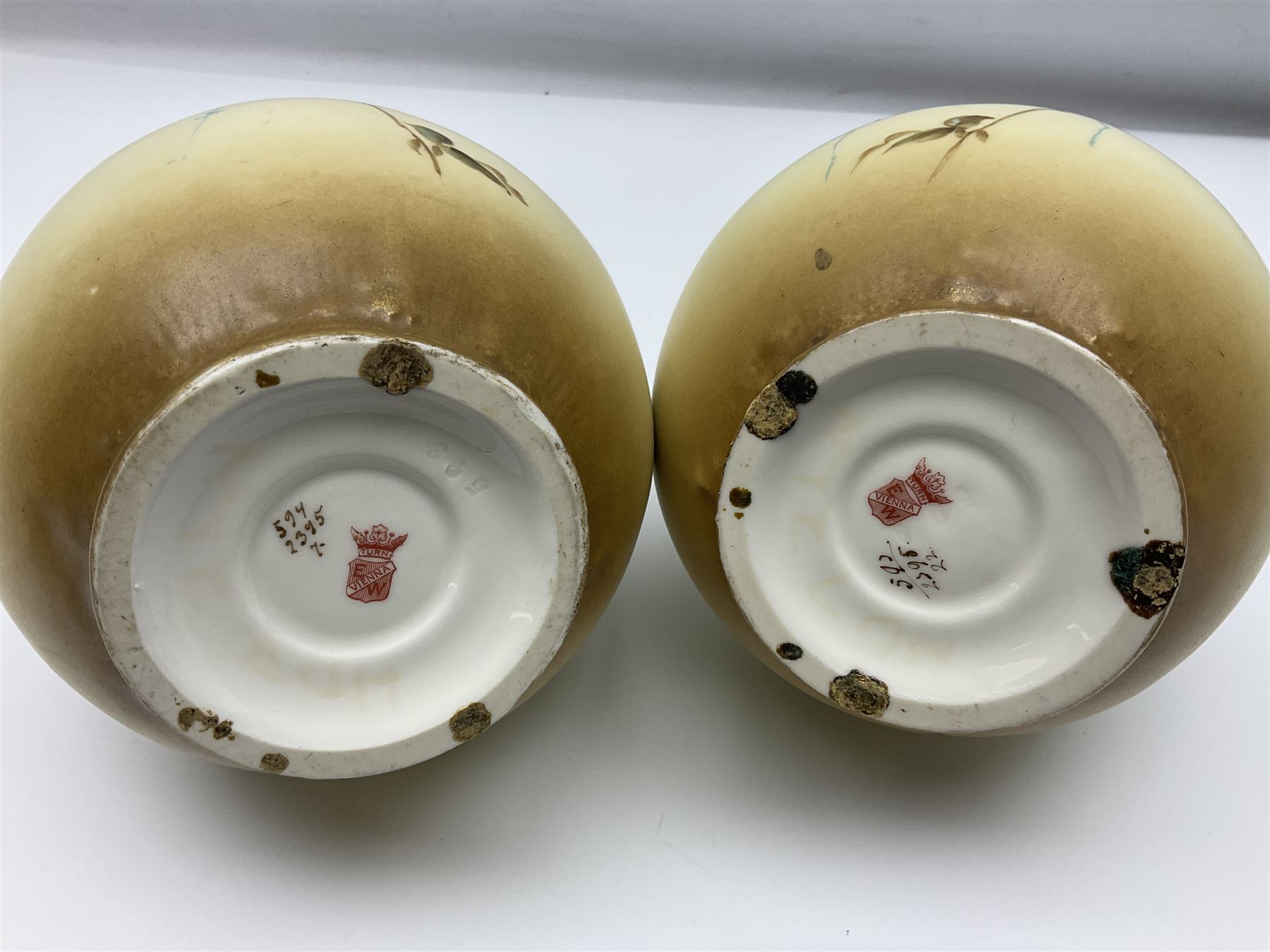 Pair of Turn Vienna blush ivory ewers decorated with floral sprays and gilt, H25cm