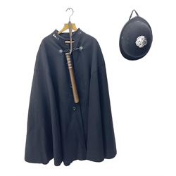 Police Constabulary style uniform items comprising woollen night cape / cloak with chain fastening, helmet and truncheon