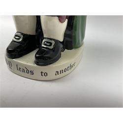 Pair of Royal Doulton Toby Ale Jugs, produced in 1934 for Charrington Ales, together with two circular metal serving trays advertising Charrington brewery, a Charrington badge awarded for 25 years of service and a 1949 menu Fox & Nicholl Ltd annual dinner dance at the toby jug hotel.  