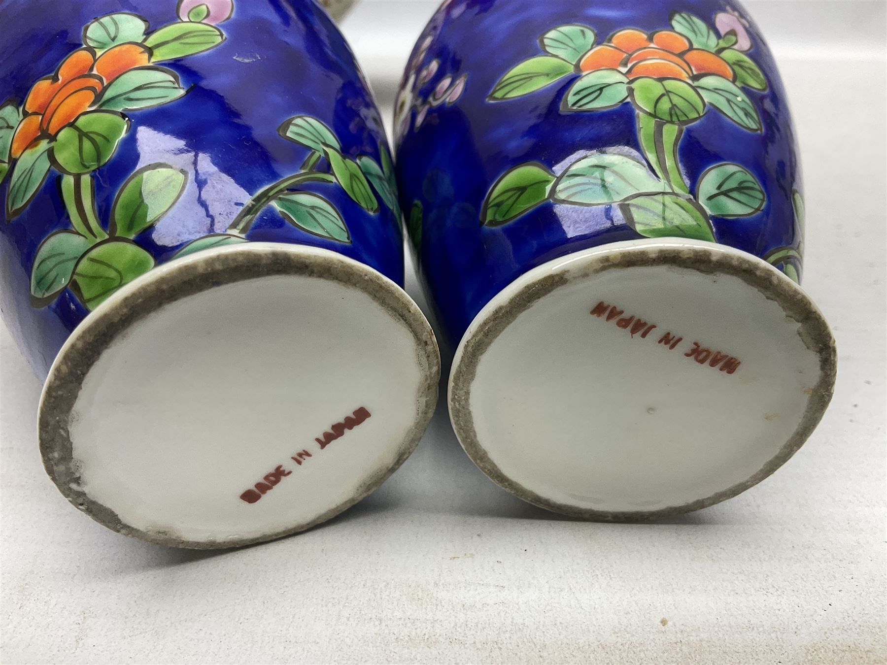 20th Century Japanese vase decorated with a blue dragon and gilding upon red yellow ground, bears Fukagawa Seiji mark (a/f), together with pair of blue cloisonné vases of baluster form decorated with blossom, and pair of Japanese vases, tallest H26cm