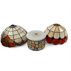 Two Tiffany style domed lampshades, together with a circular glass shade with stained glas...