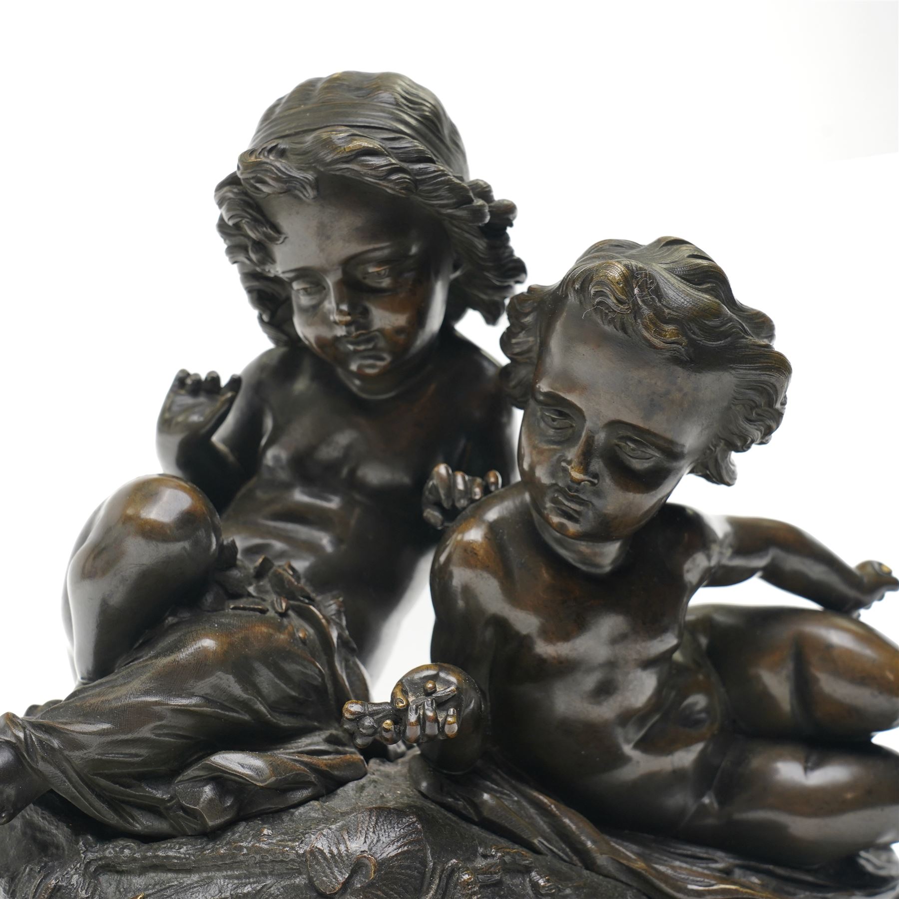 French School (20th Century); bronze depicting putti feeding a swan from a rock, unsigned, H26cm 