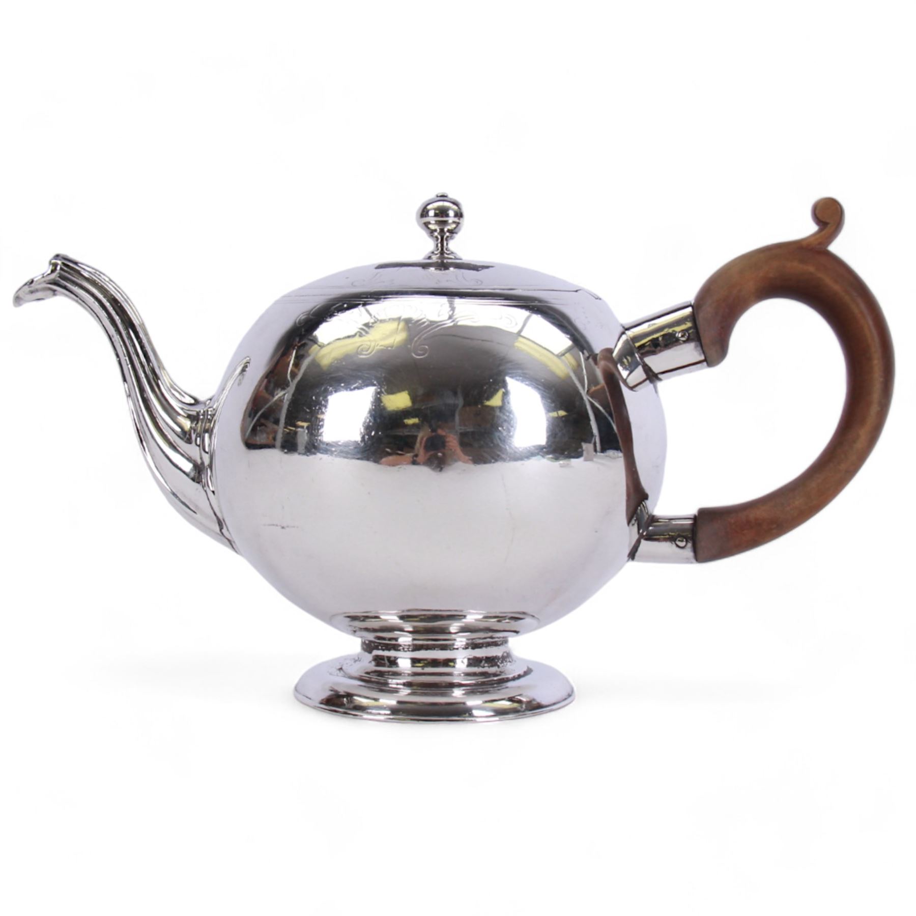 George II Scottish silver teapot, of bullet form with reeded spout and wooden scroll capped handle, upon a spreading circular foot, hallmarked John Kincard, Edinburgh 1731, H14cm