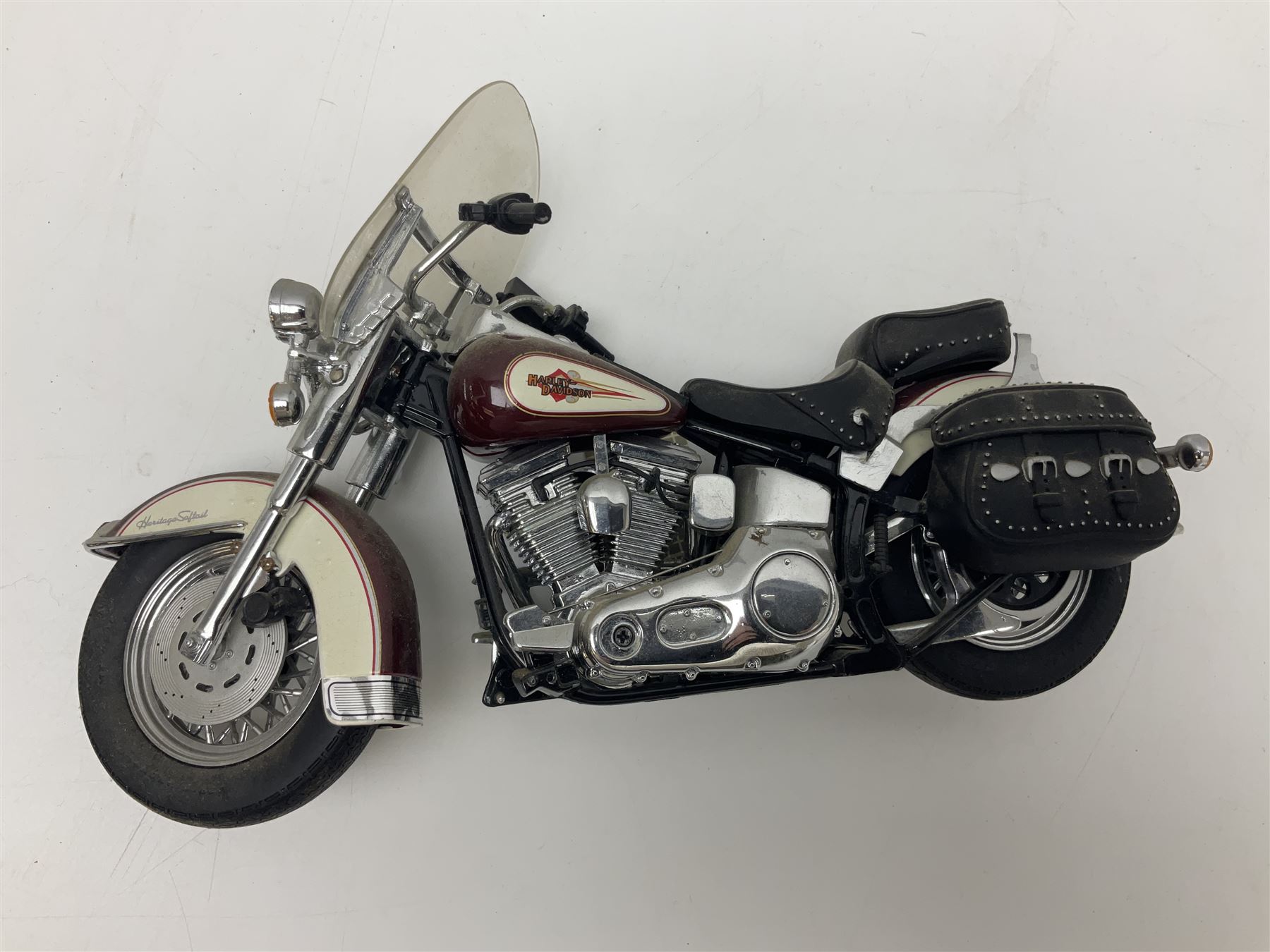 Franklin Mint - three die-cast models comprising 1:10 scale Harley Davidson Heritage Softail motorcycle, 1:24 scale 1957 VW Beetle and 1:24 scale 1993 Rolls Royce Corniche IV; all unboxed (3)