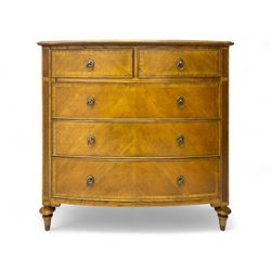 Frank Hudson - mid-20th century Mindi ash and burr walnut 'Spire' bow-fronted chest, featuring a crossbanded top over two short and three long cockbeaded drawers, raised on turned supports  