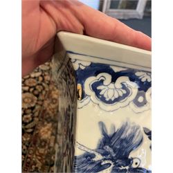Chinese blue and white planter and stand, each of square slightly tapering and flared form, the planter decorated with two dragons and blossoming peonies, between stylised borders, the stand decorated with flower heads and vines, planter H30cm W29cm, stand H7cm D28.5cm