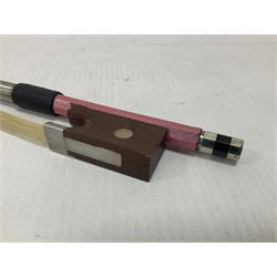 Zest full size pink violin, with a solid wood body and maple head, with matching pink bow and two further bows, in a hard case Length 60cm