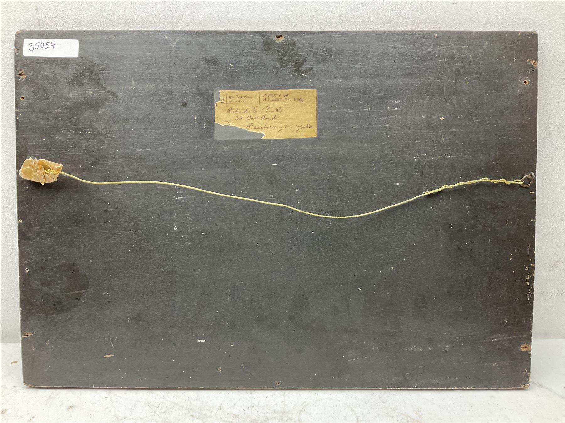 Richard Edward Clarke (British 1878-1954): 'The Haunted Orchard', oil on panel signed, original title label with artist's Scarborough address verso 35cm x 51cm (unframed) 
Notes: Clarke, born in Scarborough, studied under Albert Strange at the Art School where later he became acting Headmaster, also teaching at Pickering Grammar School.