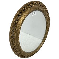 Mid-20th century gilt wood and gesso wall mirror, oval frame decorated with scrolling acanthus leaves, plain mirror plate 