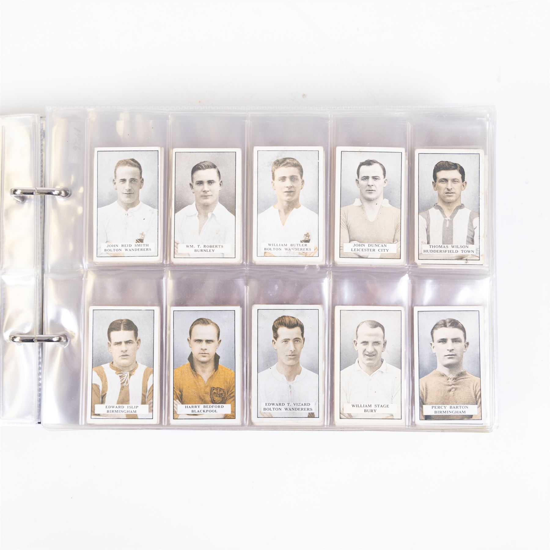 Collection of Edwardian and later Football related trading and cigarette cards, including forty-nine of fifty 1906 Ogden's Football Club Colours, 1922 PALS Footall series, ninety of one hundred 1925 Gallaher Famous Footballers, complete set of forty-four 1926 Ogden's Captains of Association Football Clubs and Colours, complete set of fifty 1927 Players Football Caricatures by MAC,  complete set of fifty 1927 Players Football Caricatures by RIP,  complete set of fifty 1930 Players Association Cup Winners, complete set of 50 1933 Ogdens AFC Nicknames etc, housed in brown cigarette card album