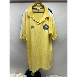 Fourteen items of replica sporting clothing including Leeds United football club shirts, England jerseys etc