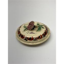 18th century creamware teapot, probably Leeds, with reeded entwined handle and floral finial to the cover, the body with hand painted polychrome decoration of figure to one side, and floral spray to the other, collectors paper label beneath inscribed Leeds Pottery, H11.5cm