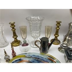 Quantity of metal ware to include a silver plated twin handled tray and a pair of brass candlesticks, and a quantity of glassware to include a Waterford dolphin figure, art glass bowl, drinking glasses, vases, paperweights etc  